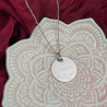 Médaille de naissance personnalisable en argent.